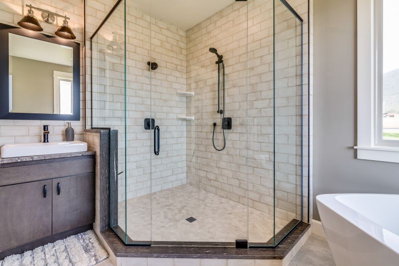 Contemporary bathroom renovation with glass shower enclosure